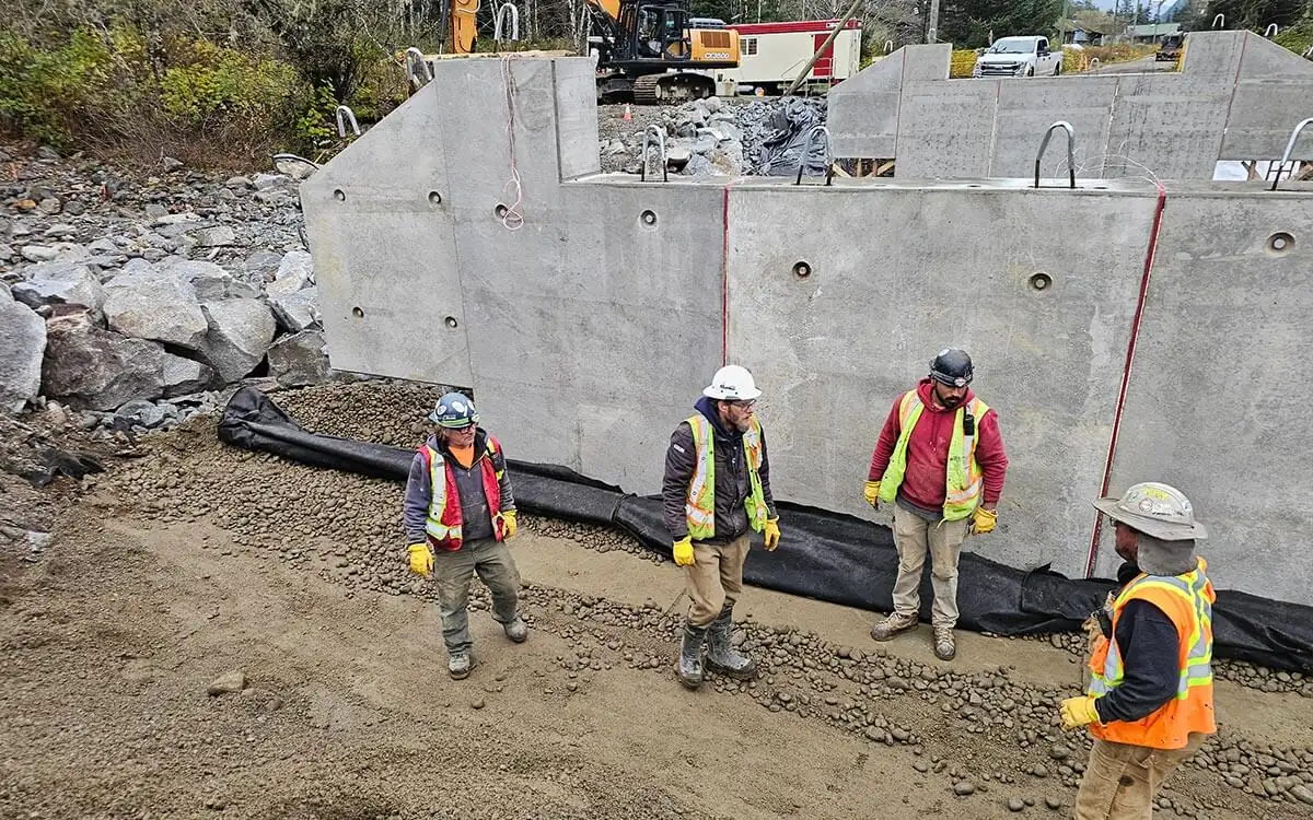 Crew in front of the new bridge abutment